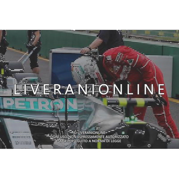 Sebastian Vettel (GER) Ferrari looks at the Mercedes AMG F1 W08 in qualifying parc ferme. 25.03.2017. Formula 1 World Championship, Rd 1, Australian Grand Prix, Albert Park, Melbourne, Australia, Qualifying Day. ONLY ITALY AG ALDO LIVERANI SAS