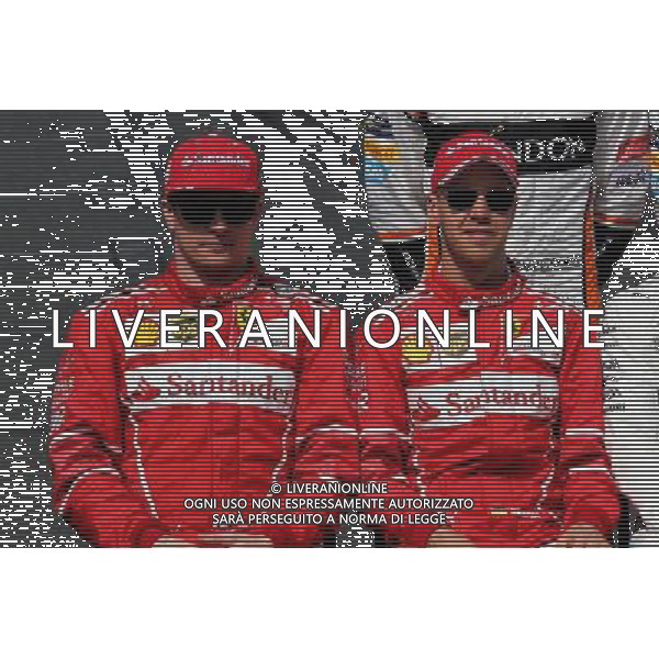 (L to R): Kimi Raikkonen (FIN) Ferrari with team mate Sebastian Vettel (GER) Ferrari at the drivers\' start of season group photograph. 26.03.2017. Formula 1 World Championship, Rd 1, Australian Grand Prix, Albert Park, Melbourne, Australia, Race Day. ONLY ITALY AG ALDO LIVERANI SAS
