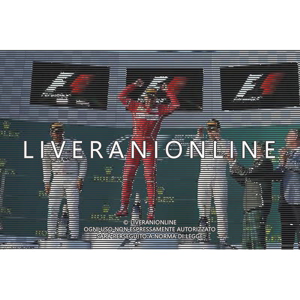 The podium (L to R): Lewis Hamilton (GBR) Mercedes AMG F1, second; Sebastian Vettel (GER) Ferrari, race winner; Valtteri Bottas (FIN) Mercedes AMG F1, third. 26.03.2017. Formula 1 World Championship, Rd 1, Australian Grand Prix, Albert Park, Melbourne, Australia, Race Day. ONLY ITALY AG ALDO LIVERANI SAS