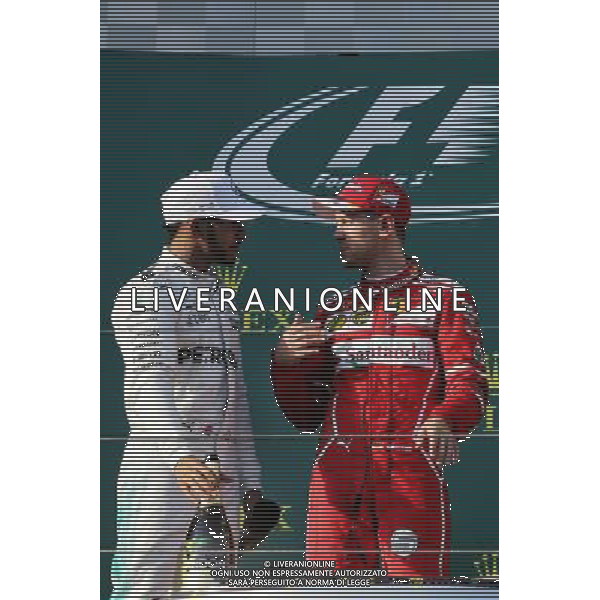 (L to R): Lewis Hamilton (GBR) Mercedes AMG F1 with race winner Sebastian Vettel (GER) Ferrari on the podium. 26.03.2017. Formula 1 World Championship, Rd 1, Australian Grand Prix, Albert Park, Melbourne, Australia, Race Day. ONLY ITALY AG ALDO LIVERANI SAS