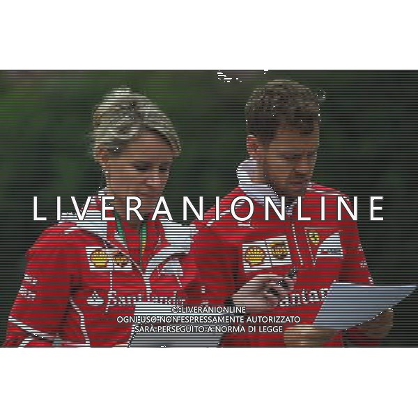 Sebastian Vettel (GER) Ferrari with Britta Roeske (AUT) Ferrari Press Officer. 06.04.2017. Formula 1 World Championship, Rd 2, Chinese Grand Prix, Shanghai, China, Preparation Day. ONLY ITALY AG ALDO LIVERANI SAS