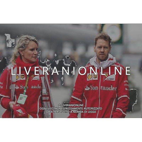 Sebastian Vettel (GER) Ferrari with Britta Roeske (AUT) Ferrari Press Officer. 07.04.2017. Formula 1 World Championship, Rd 2, Chinese Grand Prix, Shanghai, China, Practice Day. / AGENZIA ALDO LIVERANI SAS - ITALY ONLY EDITORIAL USE ONLY