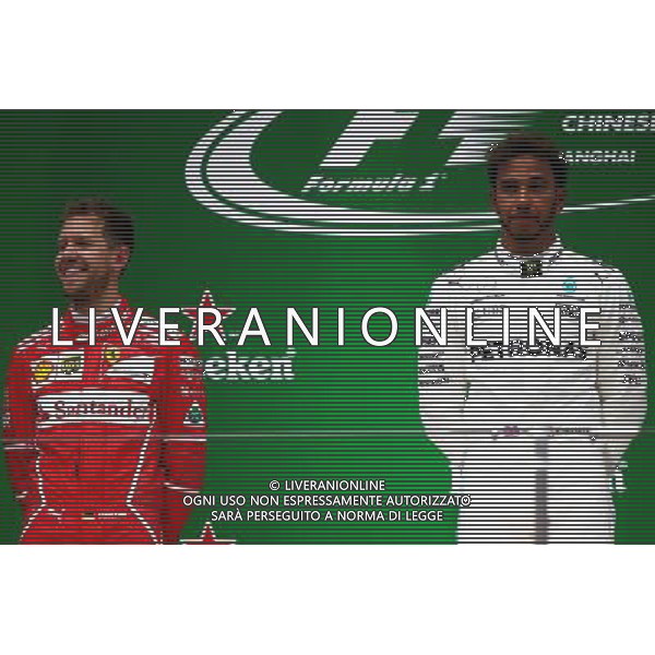 Sebastian Vettel (GER) Ferrari SF70H and Lewis Hamilton (GBR) Mercedes AMG F1 W08. 09.04.2017. Formula 1 World Championship, Rd 2, Chinese Grand Prix, Shanghai, China, Race Day. ONLY ITALY AG ALDO LIVERANI SAS