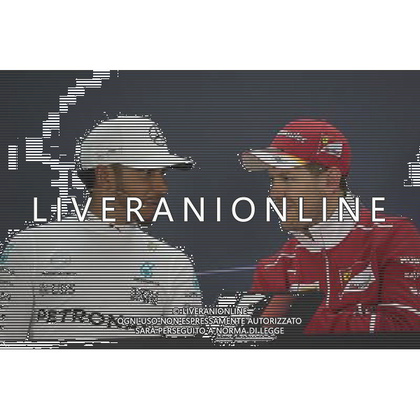 (L to R): Lewis Hamilton (GBR) Mercedes AMG F1 and Sebastian Vettel (GER) Ferrari in the FIA Press Conference. 16.04.2017. Formula 1 World Championship, Rd 3, Bahrain Grand Prix, Sakhir, Bahrain, Race Day. ONLY ITALY AG ALDO LIVERANI SAS