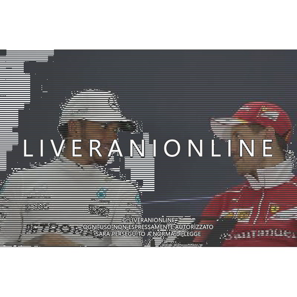 (L to R): Lewis Hamilton (GBR) Mercedes AMG F1 and Sebastian Vettel (GER) Ferrari in the FIA Press Conference. 16.04.2017. Formula 1 World Championship, Rd 3, Bahrain Grand Prix, Sakhir, Bahrain, Race Day. ONLY ITALY AG ALDO LIVERANI SAS