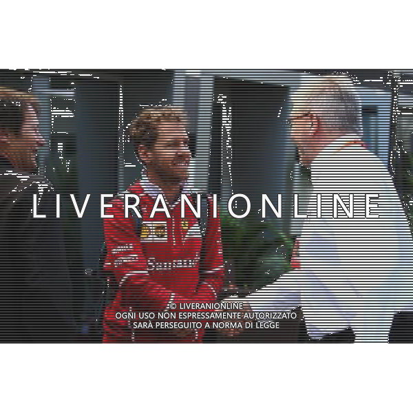 (L to R): Sebastian Vettel (GER) Ferrari with Ross Brawn (GBR) Managing Director, Motor Sports. 28.04.2017. Formula 1 World Championship, Rd 4, Russian Grand Prix, Sochi Autodrom, Sochi, Russia, Practice Day. AG ALDO LIVERANI SAS ONLY ITALY
