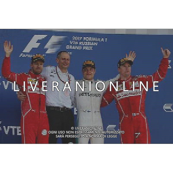 The podium (L to R): Sebastian Vettel (GER) Ferrari, second; Tony Ross (GBR) Mercedes AMG F1 Race Engineer; Valtteri Bottas (FIN) Mercedes AMG F1, race winner; Kimi Raikkonen (FIN) Ferrari, third. 30.04.2017. Formula 1 World Championship, Rd 4, Russian Grand Prix, Sochi Autodrom, Sochi, Russia, Race Day. / AGENZIA ALDO LIVERANI SAS - ITALY ONLY EDITORIAL USE ONLY