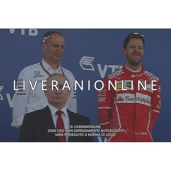 Vladimir Putin (RUS) Russian Federation President and Sebastian Vettel (GER) Ferrari. 30.04.2017. Formula 1 World Championship, Rd 4, Russian Grand Prix, Sochi Autodrom, Sochi, Russia, Race Day. / AGENZIA ALDO LIVERANI SAS - ITALY ONLY EDITORIAL USE ONLY