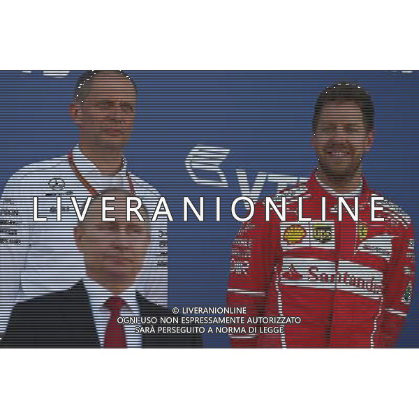 Vladimir Putin (RUS) Russian Federation President and Sebastian Vettel (GER) Ferrari. 30.04.2017. Formula 1 World Championship, Rd 4, Russian Grand Prix, Sochi Autodrom, Sochi, Russia, Race Day. / AGENZIA ALDO LIVERANI SAS - ITALY ONLY EDITORIAL USE ONLY