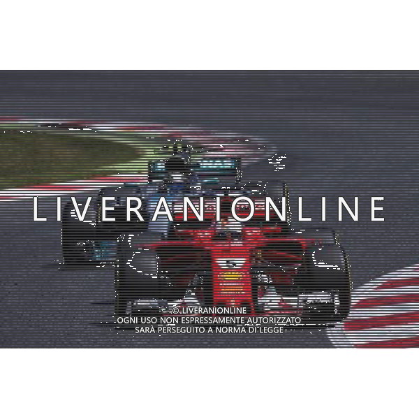 Sebastian Vettel (GER) Ferrari SF70H leads Valtteri Bottas (FIN) Mercedes AMG F1 W08. 14.05.2017. Formula 1 World Championship, Rd 5, Spanish Grand Prix, Barcelona, Spain, Race Day. AG ALDO LIVERANI SAS ONLY ITALY