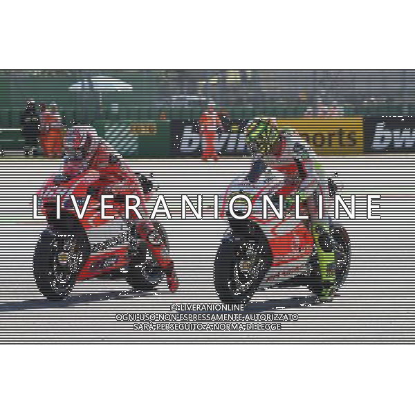 Misano Adriatico ( RN ) 13/09/2013 Misano World Circuit Marco Simoncelli. Gran Premio Aperol di San Marino e della Riviera di Rimini 2013 - MOTOGP Nella foto: Andrea Iannone ( ITA ) su DUCATI con Nicky Hayden ( USA ) su DUCATI mentre st‡ effettuando una prova di partenza PH Lauro Montagnini *** Local Caption *** /AGENZIA ALDO LIVERANI SAS *** Local Caption *** /AGENZIA ALDO LIVERANI SAS