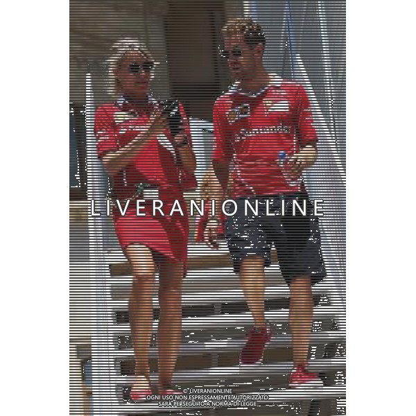 Sebastian Vettel (GER) Ferrari with Britta Roeske (AUT) Ferrari Press Officer. 24.06.2017. Formula 1 World Championship, Rd 8, Azerbaijan Grand Prix, Baku Street Circuit, Azerbaijan, Qualifying Day. / AGENZIA ALDO LIVERANI SAS - ITALY ONLY EDITORIAL USE ONLY - - Gp F1 Baku Street Circuit, Azerbaijan, Prove Ufficiali Qualifiche 24.06.2017.