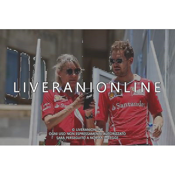 Sebastian Vettel (GER) Ferrari with Britta Roeske (AUT) Ferrari Press Officer. 24.06.2017. Formula 1 World Championship, Rd 8, Azerbaijan Grand Prix, Baku Street Circuit, Azerbaijan, Qualifying Day. / AGENZIA ALDO LIVERANI SAS - ITALY ONLY EDITORIAL USE ONLY - - Gp F1 Baku Street Circuit, Azerbaijan, Prove Ufficiali Qualifiche 24.06.2017.