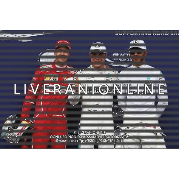 Qualifying top three in parc ferme (L to R): Sebastian Vettel (GER) Ferrari, second; Valtteri Bottas (FIN) Mercedes AMG F1, pole position; Lewis Hamilton (GBR) Mercedes AMG F1, third. 08.07.2017. Formula 1 World Championship, Rd 9, Austrian Grand Prix, Spielberg, Austria, Qualifying Day. / AGENZIA ALDO LIVERANI SAS - ITALY ONLY EDITORIAL USE ONLY