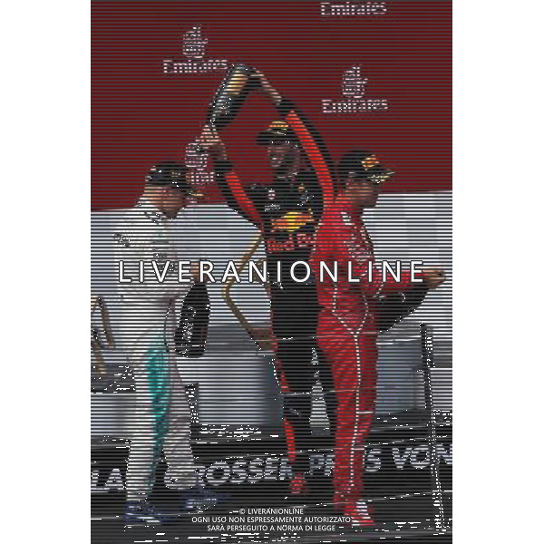 The podium (L to R): race winner Valtteri Bottas (FIN) Mercedes AMG F1 celebrates with the champagne with third placed Daniel Ricciardo (AUS) Red Bull Racing and second placed Sebastian Vettel (GER) Ferrari. 09.07.2017. Formula 1 World Championship, Rd 9, Austrian Grand Prix, Spielberg, Austria, Race Day. AG ALDO LIVERANI SAS ONLY ITALY