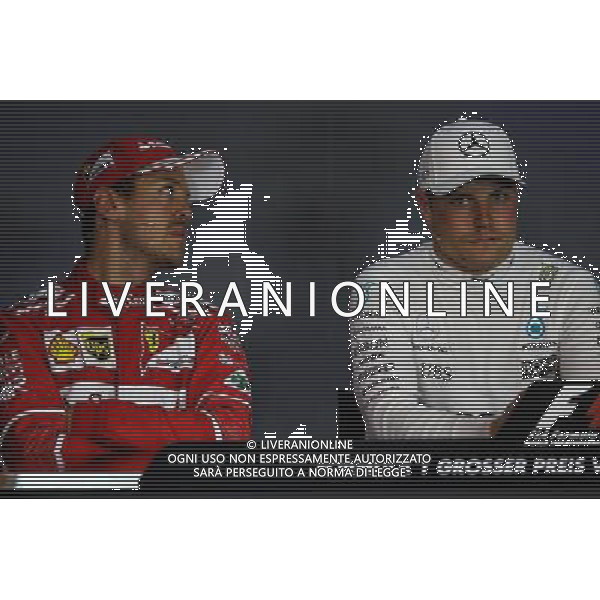 (L to R): Sebastian Vettel (GER) Ferrari with Valtteri Bottas (FIN) Mercedes AMG F1 in the FIA Press Conference. 09.07.2017. Formula 1 World Championship, Rd 9, Austrian Grand Prix, Spielberg, Austria, Race Day. AG ALDO LIVERANI SAS ONLY ITALY