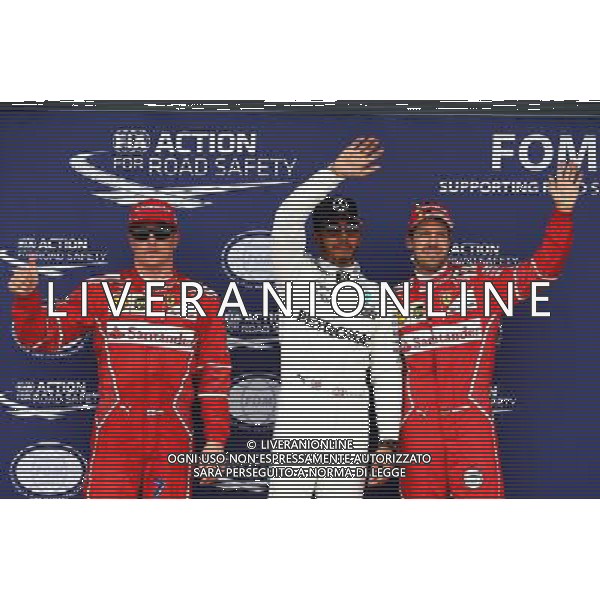 Qualifying top three in parc ferme (L to R): Kimi Raikkonen (FIN) Ferrari, second; Lewis Hamilton (GBR) Mercedes AMG F1, pole position; Sebastian Vettel (GER) Ferrari, third. 15.07.2017. Formula 1 World Championship, Rd 10, British Grand Prix, Silverstone, England, Qualifying Day. AG ALDO LIVERANI SAS ONLY ITALY