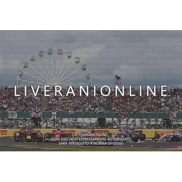 Kimi Raikkonen (FIN) Ferrari SF70H leads Max Verstappen (NLD) Red Bull Racing RB13 and Sebastian Vettel (GER) Ferrari SF70H at the start of the race. 16.07.2017. Formula 1 World Championship, Rd 10, British Grand Prix, Silverstone, England, Race Day. / AGENZIA ALDO LIVERANI SAS - ITALY ONLY EDITORIAL USE ONLY - Gp F1 Inghilterra Gara 16.07.2017