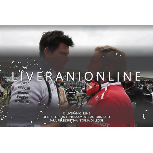 (L to R): Toto Wolff (GER) Mercedes AMG F1 Shareholder and Executive Director with Gino Rosato (CDN) Ferrari on the grid. 16.07.2017. Formula 1 World Championship, Rd 10, British Grand Prix, Silverstone, England, Race Day. AG ALDO LIVERANI SAS ONLY ITALY
