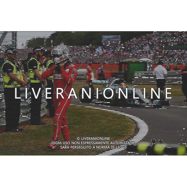 Sebastian Vettel (GER) Ferrari in parc ferme as race winner Lewis Hamilton (GBR) Mercedes AMG F1 W08 arrives. 16.07.2017. Formula 1 World Championship, Rd 10, British Grand Prix, Silverstone, England, Race Day. AG ALDO LIVERANI SAS ONLY ITALY