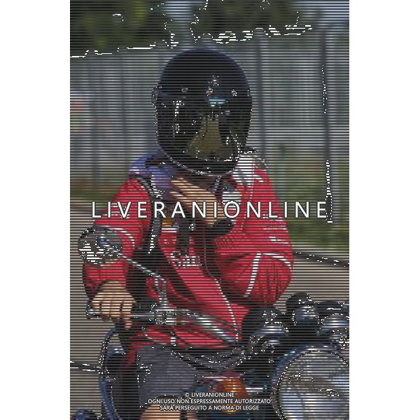 Sebastian Vettel (GER) Ferrari arrives on a motorbike. 29.07.2017. Formula 1 World Championship, Rd 11, Hungarian Grand Prix, Budapest, Hungary, Qualifying Day. /AGENZIA ALDO LIVERANI SAS - ITALY ONLY - EDITORIAL USE ONLY - GP F1 UNGHERIA PROVE UFFICIALI QUALIFICHE 29/07/2017