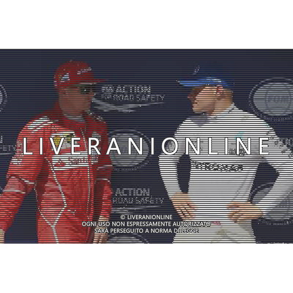 Kimi Raikkonen (FIN) Ferrari SF70H and Valtteri Bottas (FIN) Mercedes AMG F1 W08. 29.07.2017. Formula 1 World Championship, Rd 11, Hungarian Grand Prix, Budapest, Hungary, Qualifying Day. /AGENZIA ALDO LIVERANI SAS - ITALY ONLY - EDITORIAL USE ONLY - GP F1 UNGHERIA PROVE UFFICIALI QUALIFICHE 29/07/2017