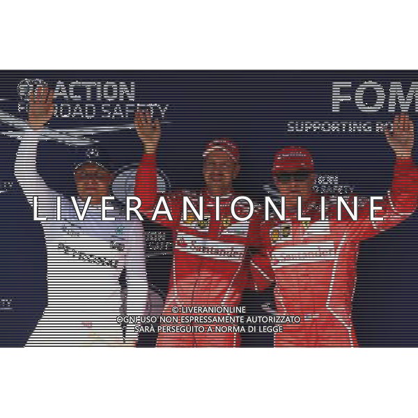 Qualifying top three in parc ferme (L to R): Valtteri Bottas (FIN) Mercedes AMG F1, third, Sebastian Vettel (GER) Ferrari; pole position; Kimi Raikkonen (FIN) Ferrari, second. 29.07.2017. Formula 1 World Championship, Rd 11, Hungarian Grand Prix, Budapest, Hungary, Qualifying Day. /AGENZIA ALDO LIVERANI SAS - ITALY ONLY - EDITORIAL USE ONLY - GP F1 UNGHERIA PROVE UFFICIALI QUALIFICHE 29/07/2017