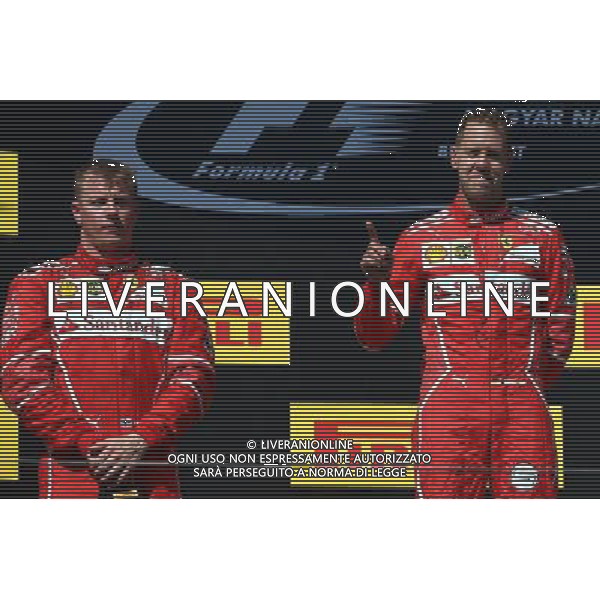 1st place Sebastian Vettel (GER) Ferrari SF70H, 2nd place Kimi Raikkonen (FIN) Ferrari SF70H and 3rd place. 30.07.2017. Formula 1 World Championship, Rd 11, Hungarian Grand Prix, Budapest, Hungary, Race Day. /AGENZIA ALDO LIVERANI SAS - ITALY ONLY - EDITORIAL USE ONLY - - GP F1 BUDAPEST UNGHERIA GARA 30/07/2017