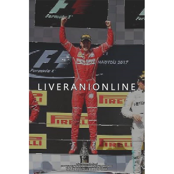 Race winner Sebastian Vettel (GER) Ferrari celebrates on the podium. 30.07.2017. Formula 1 World Championship, Rd 11, Hungarian Grand Prix, Budapest, Hungary, Race Day. /AGENZIA ALDO LIVERANI SAS - ITALY ONLY - EDITORIAL USE ONLY - - GP F1 BUDAPEST UNGHERIA GARA 30/07/2017