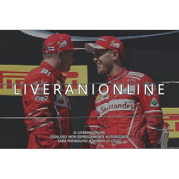 (L to R): second placed Kimi Raikkonen (FIN) Ferrari with team mate and race winner Sebastian Vettel (GER) Ferrari. 30.07.2017. Formula 1 World Championship, Rd 11, Hungarian Grand Prix, Budapest, Hungary, Race Day. /AGENZIA ALDO LIVERANI SAS - ITALY ONLY - EDITORIAL USE ONLY - - GP F1 BUDAPEST UNGHERIA GARA 30/07/2017