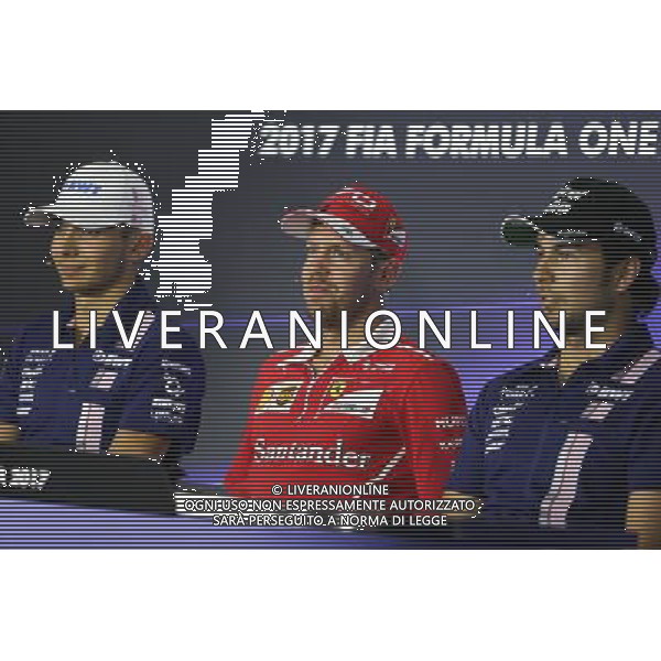 (L to R): Esteban Ocon (FRA) Sahara Force India F1 Team with Sergio Perez (MEX) Sahara Force India F1 and Sebastian Vettel (GER) Ferrari in the FIA Press Conference. 31.08.2017. Formula 1 World Championship, Rd 13, Italian Grand Prix, Monza, Italy, Preparation Day. / AGENZIA ALDO LIVERANI SAS - ITALY ONLY - EDITORIAL USE ONLY