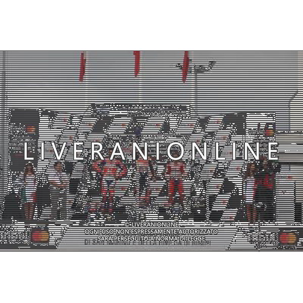 Misano Adriatico ( RN ) 10/09/2017 Misano World Circuit Marco Simoncelli. Gran Premio Tribul Mastercard di San Marino e della Riviera di Rimini 2017 - MOTOGP Premiazione Nella foto: 2 Class. Danilo Petrucci ( ITA ) su DUCATI, il vincitore Marc Marquez ( ESP ) su HONDA e 3 Class. Andrea Dovizioso ( ITA ) su DUCATI sul podio PH Lauro Montagnini AG ALDO LIVERANI SAS