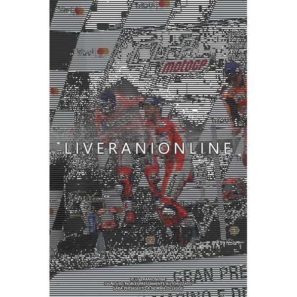 Misano Adriatico ( RN ) 10/09/2017 Misano World Circuit Marco Simoncelli. Gran Premio Tribul Mastercard di San Marino e della Riviera di Rimini 2017 - MOTOGP Premiazione Nella foto: 2 Class. Danilo Petrucci ( ITA ) su DUCATI, il vincitore Marc Marquez ( ESP ) su HONDA e 3 Class. Andrea Dovizioso ( ITA ) su DUCATI sul podio PH Lauro Montagnini AG ALDO LIVERANI SAS