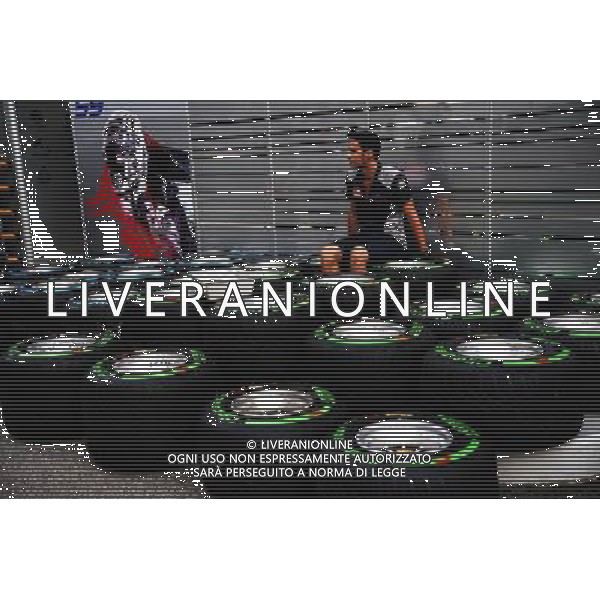 Scuderia Toro Rosso mechanic with Pirelli tyres. 14.09.2017. Formula 1 World Championship, Rd 14, Singapore Grand Prix, Marina Bay Street Circuit, Singapore, Preparation Day. AG ALDO LIVERANI SAS ONLY ITALY