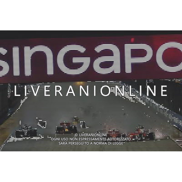Sebastian Vettel (GER) Ferrari SF70H, Kimi Raikkonen (FIN) Ferrari SF70H, and Max Verstappen (NLD) Red Bull Racing RB13, crash at the start of the race. 17.09.2017. Formula 1 World Championship, Rd 14, Singapore Grand Prix, Marina Bay Street Circuit, Singapore, Race Day. AG ALDO LIVERANI SAS ONLY ITALY