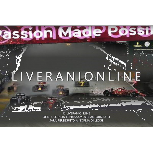 Sebastian Vettel (GER) Ferrari SF70H, Kimi Raikkonen (FIN) Ferrari SF70H, and Max Verstappen (NLD) Red Bull Racing RB13, crash at the start of the race. 17.09.2017. Formula 1 World Championship, Rd 14, Singapore Grand Prix, Marina Bay Street Circuit, Singapore, Race Day. AG ALDO LIVERANI SAS ONLY ITALY