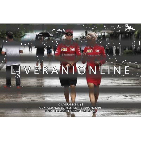 Sebastian Vettel (GER) Ferrari with Britta Roeske (AUT) Ferrari Press Officer. 28.09.2017. Formula 1 World Championship, Rd 15, Malaysian Grand Prix, Sepang, Malaysia, Thursday. AG ALDO LIVERANI SAS ONLY ITALY