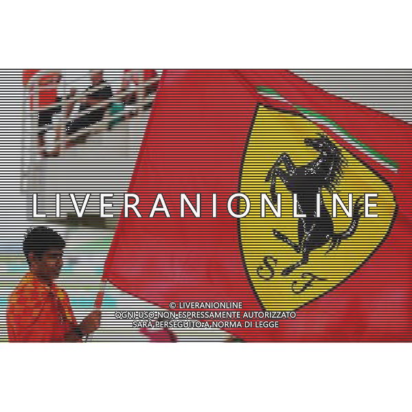 A Ferrari fan with a flag. 29.09.2017. Formula 1 World Championship, Rd 15, Malaysian Grand Prix, Sepang, Malaysia, Friday. AG ALDO LIVERANI SAS ONLY ITALY