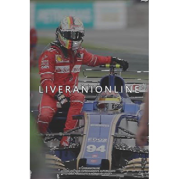 Sebastian Vettel (GER) Ferrari SF70H gets a lift to the pits 01.10.2017. Formula 1 World Championship, Rd 15, Malaysian Grand Prix, Sepang, Malaysia, Sunday. AG ALDO LIVERANI SAS ONLY ITALY