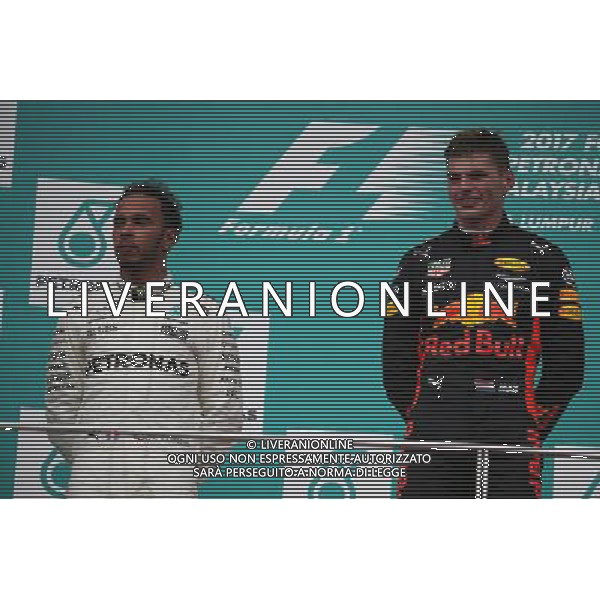 2nd place Lewis Hamilton (GBR) Mercedes AMG F1 W08 and 1st place Max Verstappen (NLD) Red Bull Racing. 01.10.2017. Formula 1 World Championship, Rd 15, Malaysian Grand Prix, Sepang, Malaysia, Sunday. AG ALDO LIVERANI SAS ONLY ITALY