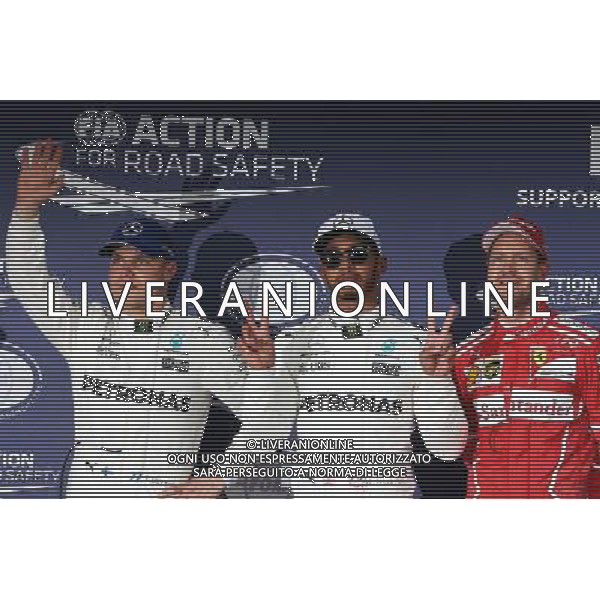 Qualifying top three in parc ferme (L to R): Valtteri Bottas (FIN) Mercedes AMG F1, second; Lewis Hamilton (GBR) Mercedes AMG F1, pole position; Sebastian Vettel (GER) Ferrari, third. 07.10.2017. Formula 1 World Championship, Rd 16, Japanese Grand Prix, Suzuka, Japan, Qualifying Day. / AGENZIA ALDO LIVERANI SAS - ITALY ONLY EDITORIAL USE ONLY - Prove Ufficiali Qualifiche Gp F1 Giappone - Suzuka 7 ottobre 2017