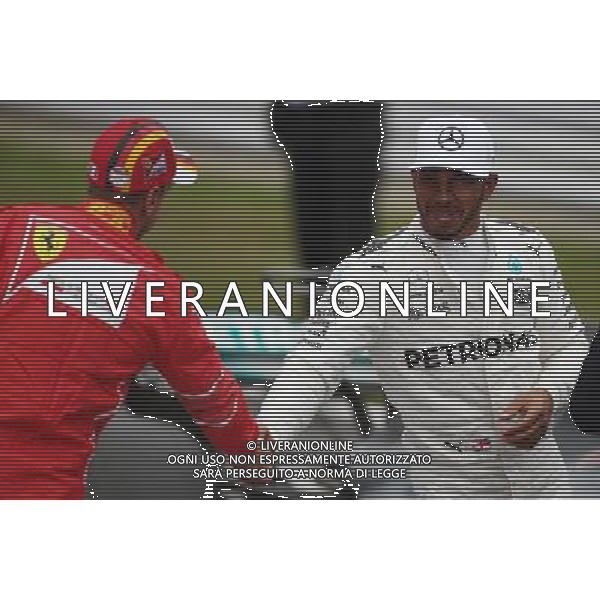 Sebastian Vettel (GER) Scuderia Ferrari and Lewis Hamilton (GBR) Mercedes AMG F1 07.10.2017. Formula 1 World Championship, Rd 16, Japanese Grand Prix, Suzuka, Japan, Qualifying Day. / AGENZIA ALDO LIVERANI SAS - ITALY ONLY EDITORIAL USE ONLY - Prove Ufficiali Qualifiche Gp F1 Giappone - Suzuka 7 ottobre 2017