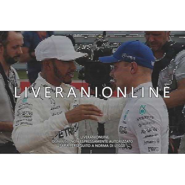 Lewis Hamilton (GBR) Mercedes AMG F1 celebrates his pole position in qualifying parc ferme with team mate Valtteri Bottas (FIN) Mercedes AMG F1. 21.10.2017. Formula 1 World Championship, Rd 17, United States Grand Prix, Austin, Texas, USA, Qualifying Day. AG ALDO LIVERANI SAS ONLY ITALY