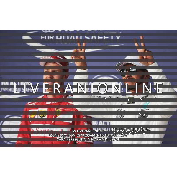 (L to R): Sebastian Vettel (GER) Ferrari with pole sitter Lewis Hamilton (GBR) Mercedes AMG F1 in qualifying parc ferme. 21.10.2017. Formula 1 World Championship, Rd 17, United States Grand Prix, Austin, Texas, USA, Qualifying Day. AG ALDO LIVERANI SAS ONLY ITALY