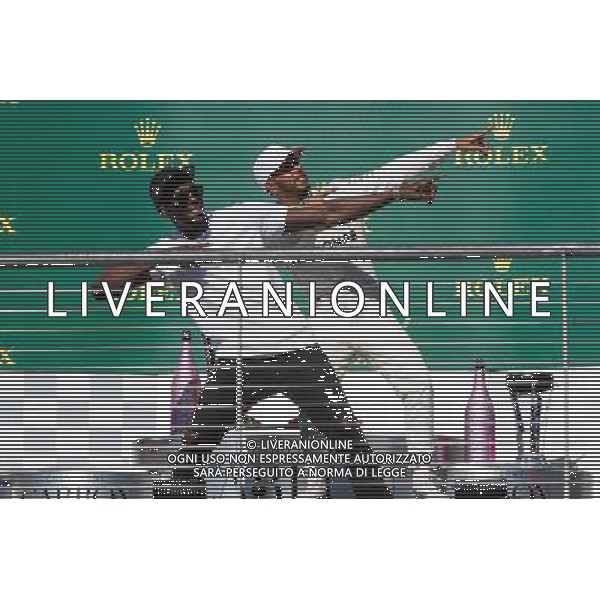 (L to R): Usain Bolt (JAM) Athlete with Lewis Hamilton (GBR) Mercedes AMG F1 on the podium. 22.10.2017. Formula 1 World Championship, Rd 17, United States Grand Prix, Austin, Texas, USA, Race Day. / AGENZIA ALDO LIVERANI SAS - ITALY ONLY EDITORIAL USE ONLY