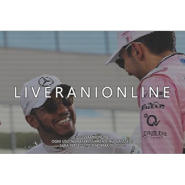 (L to R): Lewis Hamilton (GBR) Mercedes AMG F1 with Esteban Ocon (FRA) Sahara Force India F1 Team on the drivers parade. 26.11.2017. Formula 1 World Championship, Rd 20, Abu Dhabi Grand Prix, Yas Marina Circuit, Abu Dhabi, Race Day. AG ALDO LIVERANI SAS ONLY ITALY