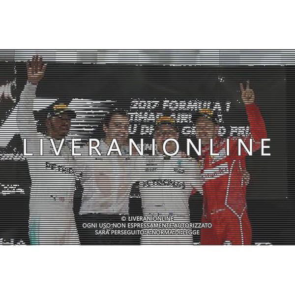 The podium (L to R): Lewis Hamilton (GBR) Mercedes AMG F1, second; Valtteri Bottas (FIN) Mercedes AMG F1, race winner; Sebastian Vettel (GER) Ferrari, third. 26.11.2017. Formula 1 World Championship, Rd 20, Abu Dhabi Grand Prix, Yas Marina Circuit, Abu Dhabi, Race Day. AG ALDO LIVERANI SAS ONLY ITALY