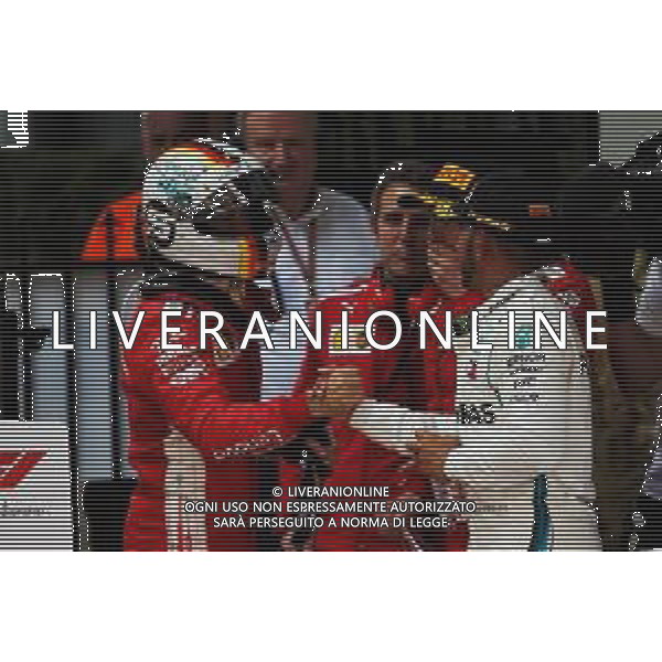 (L to R): Race winner Sebastian Vettel (GER) Ferrari celebrates with Lewis Hamilton (GBR) Mercedes AMG F1 in parc ferme. 25.03.2018. Formula 1 World Championship, Rd 1, Australian Grand Prix, Albert Park, Melbourne, Australia, Race Day. / AGENZIA ALDO LIVERANI SAS - ITALY ONLY EDITORIAL USE ONLY