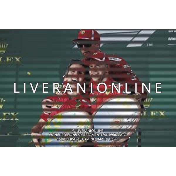 Inaki Rueda (ESP) Ferrari Race Strategist (Left) celebrates on the podium with race winner Sebastian Vettel (GER) Ferrari (Right) and third placed Kimi Raikkonen (FIN) Ferrari (Centre). 25.03.2018. Formula 1 World Championship, Rd 1, Australian Grand Prix, Albert Park, Melbourne, Australia, Race Day. AG ALDO LIVERANI SAS ONLY ITALY
