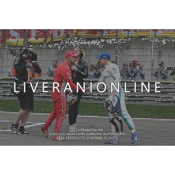 Sebastian Vettel (GER) Scuderia Ferrari and Valtteri Bottas (FIN) Mercedes AMG F1 14.04.2018. Formula 1 World Championship, Rd 3, Chinese Grand Prix, Shanghai, China, Qualifying Day. / AGENZIA ALDO LIVERANI SAS - ITALY ONLY EDITORIAL USE ONLY - F1 Gp Cina Prove Ufficiali Qualifiche , Motor Racing - Formula One World Championship - Chinese Grand Prix - Practice Day - Shanghai, China 14.04.2018